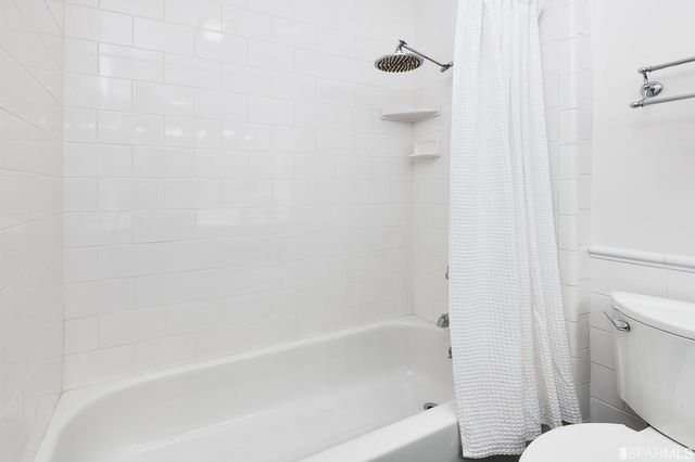 a view of a chairs and table on the roof deck