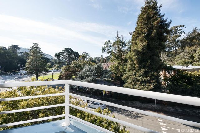 a living room with furniture wooden floor and a fireplace