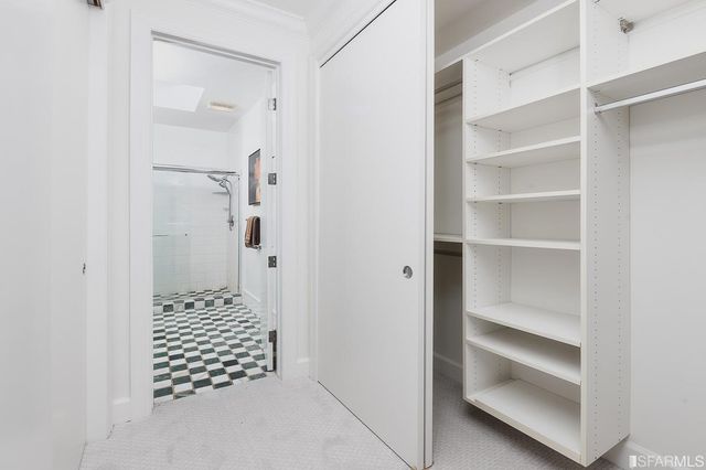 a bedroom with a bed and a cabinets