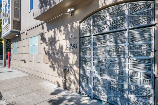 a living room with furniture wooden floor and a large window