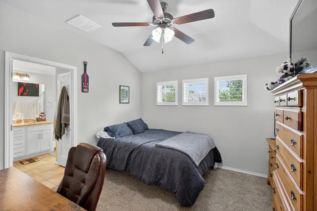 a bedroom with a bed furniture and a window