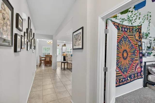 a view of a hallway with seating area