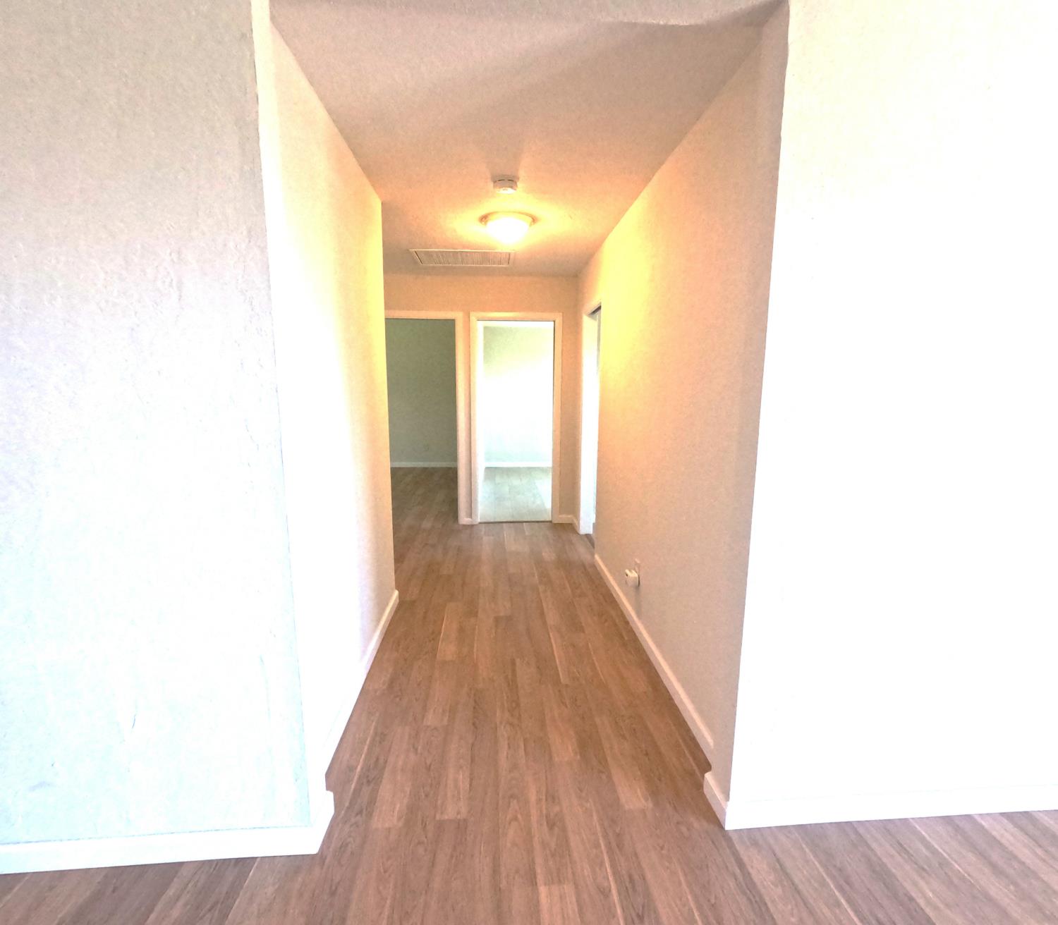 21665 Manton School Road Manton, CA 96059 - Photo 7 of 30 a view of a hallway with wooden floor