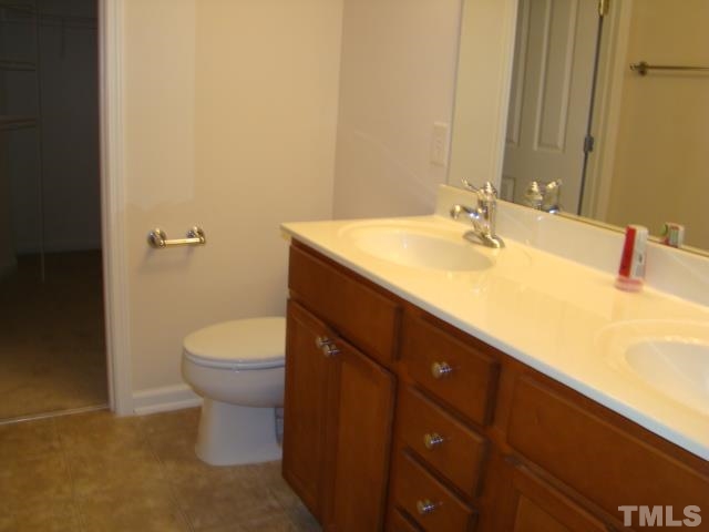 8330 Pilots View Drive Raleigh, NC 27617 - Photo 12 of 15 a bathroom with a sink and a toilet