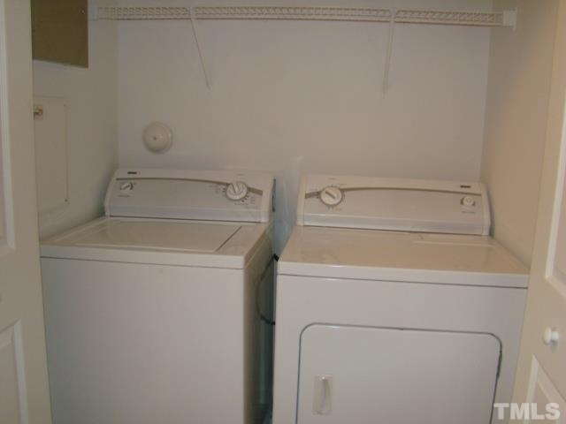 8330 Pilots View Drive Raleigh, NC 27617 - Photo 15 of 15 a utility room with dryer and washer