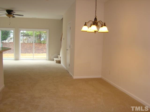 8330 Pilots View Drive Raleigh, NC 27617 - Photo 6 of 15 a view of empty room with windows
