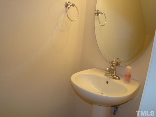 8330 Pilots View Drive Raleigh, NC 27617 - Photo 7 of 15 a bathroom with a sink a mirror and a shower