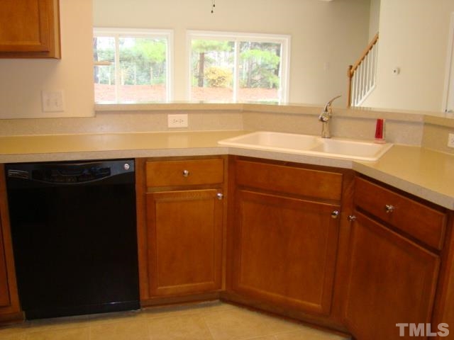 8330 Pilots View Drive Raleigh, NC 27617 - Photo 9 of 15 a kitchen with a sink and a window