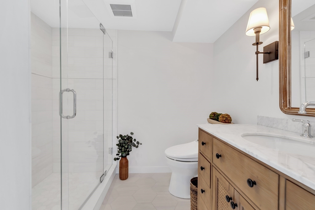 90 Salt Marsh Road East Sandwich, MA 02537 - Photo 24 of 40 a bathroom with a sink toilet and shower