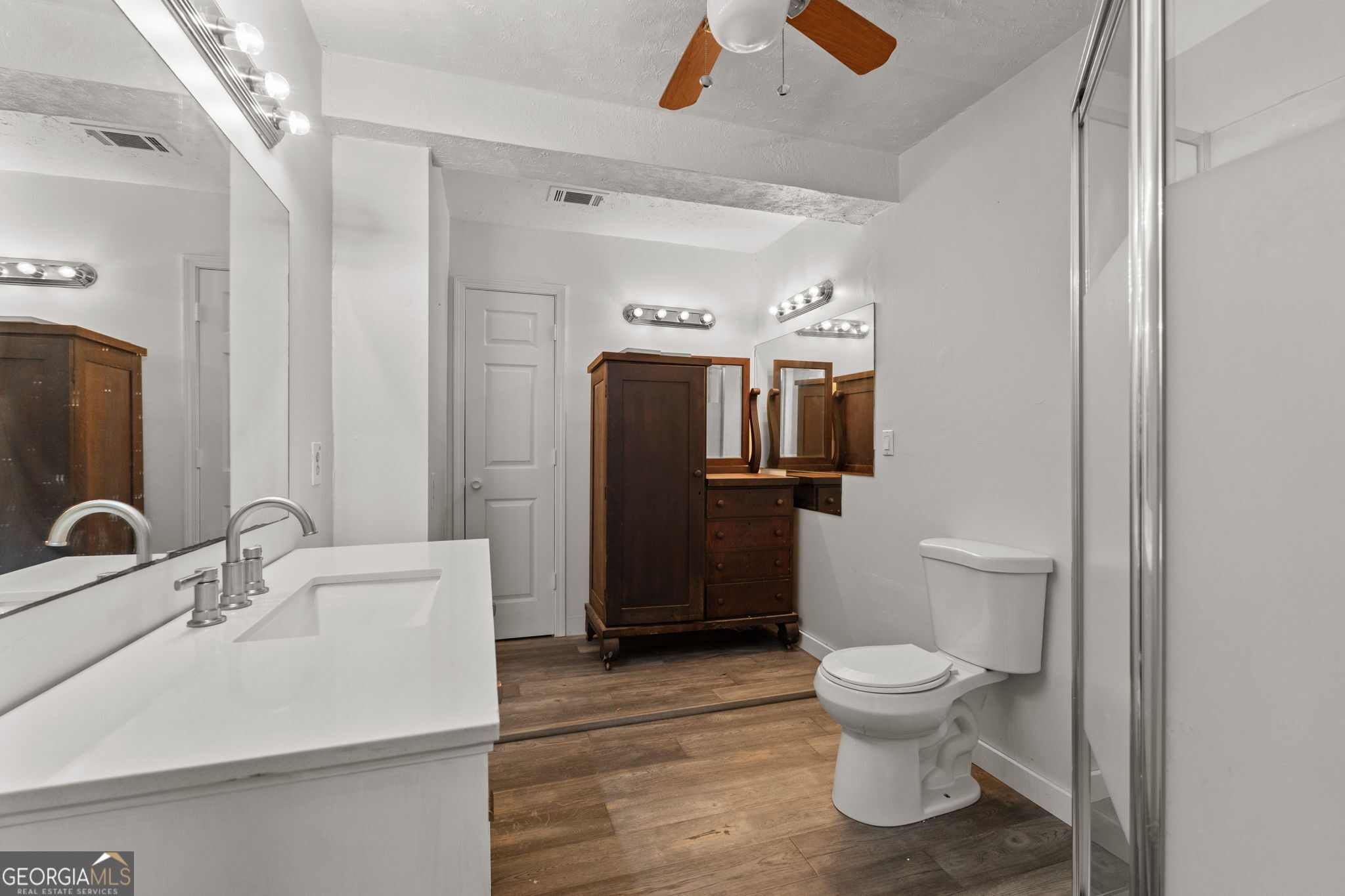 49 Frost Road Bowdon, GA 30108 - Photo 29 of 60 a bathroom with a sink toilet and shower