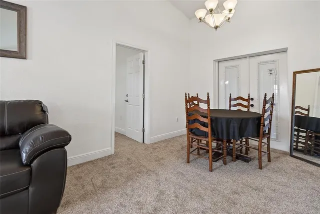 a kitchen with stainless steel appliances granite countertop a sink a stove top oven and refrigerator