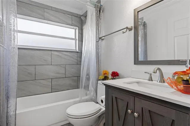 a bathroom with a sink and vanity
