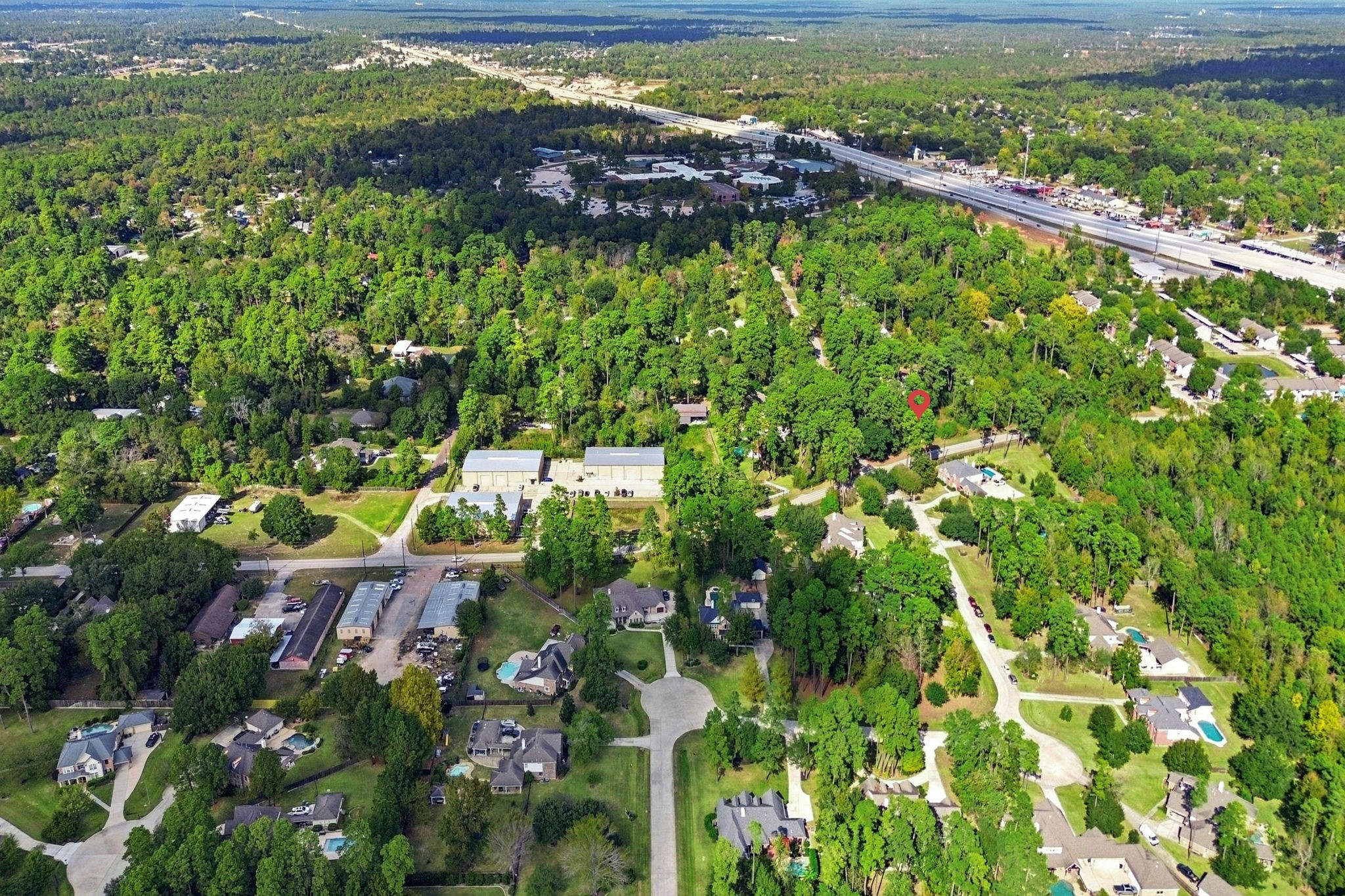 0 Keen Road Tomball, TX 77377 - Photo 11 of 16 a view of a garden with a building in the background