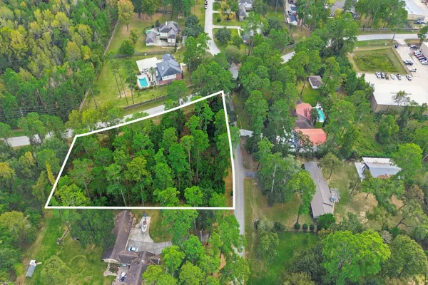 an aerial view of multiple houses with yard