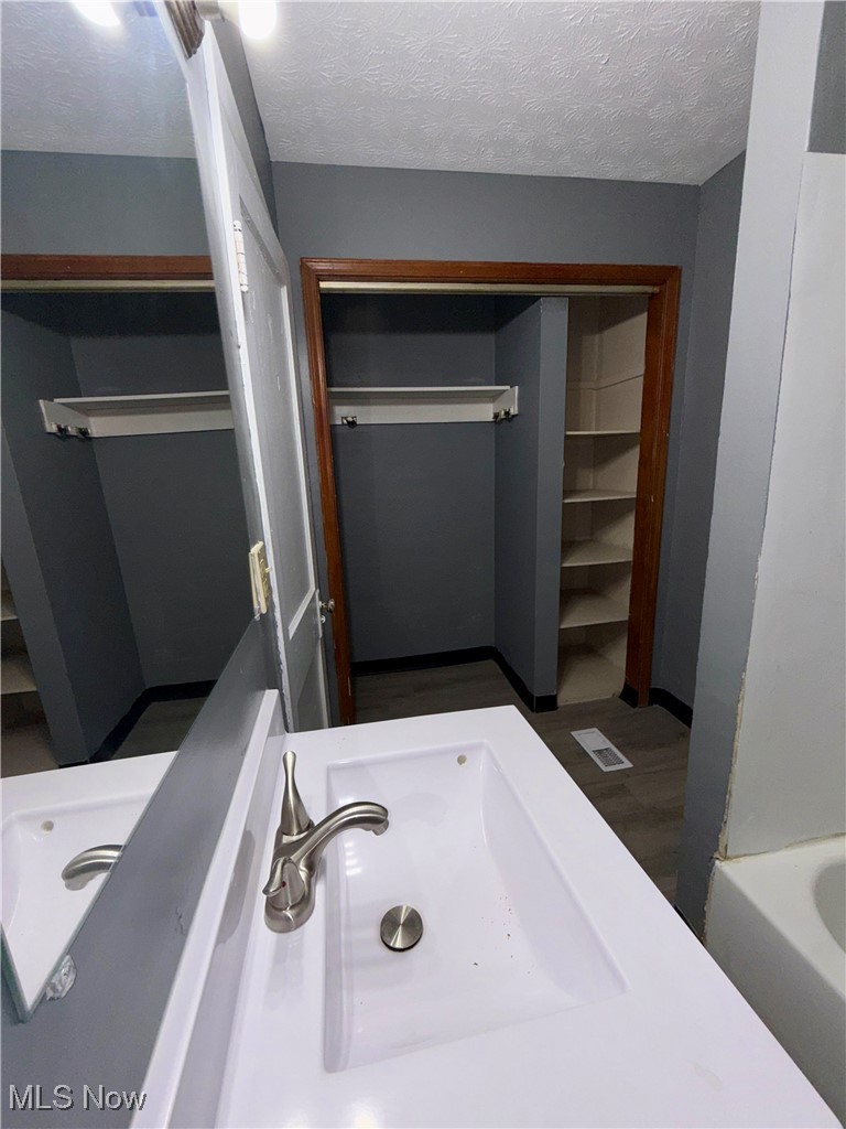 15937 Whitcomb Road Cleveland, OH 44110 - Photo 10 of 14 Bathroom with a textured ceiling