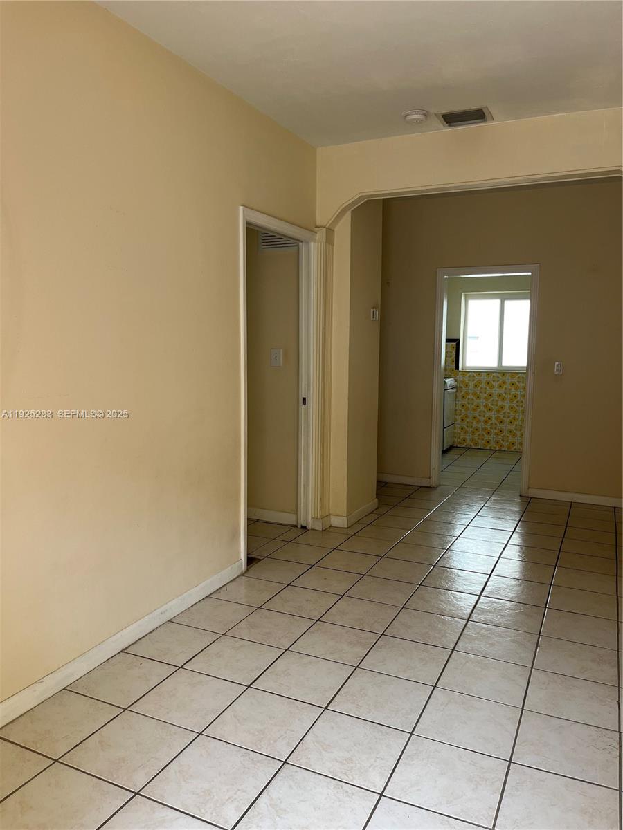 1035 Southwest 3rd Street, Unit 2 Miami, FL 33130 - Photo 4 of 13 a view of a hallway to rooms and stairs