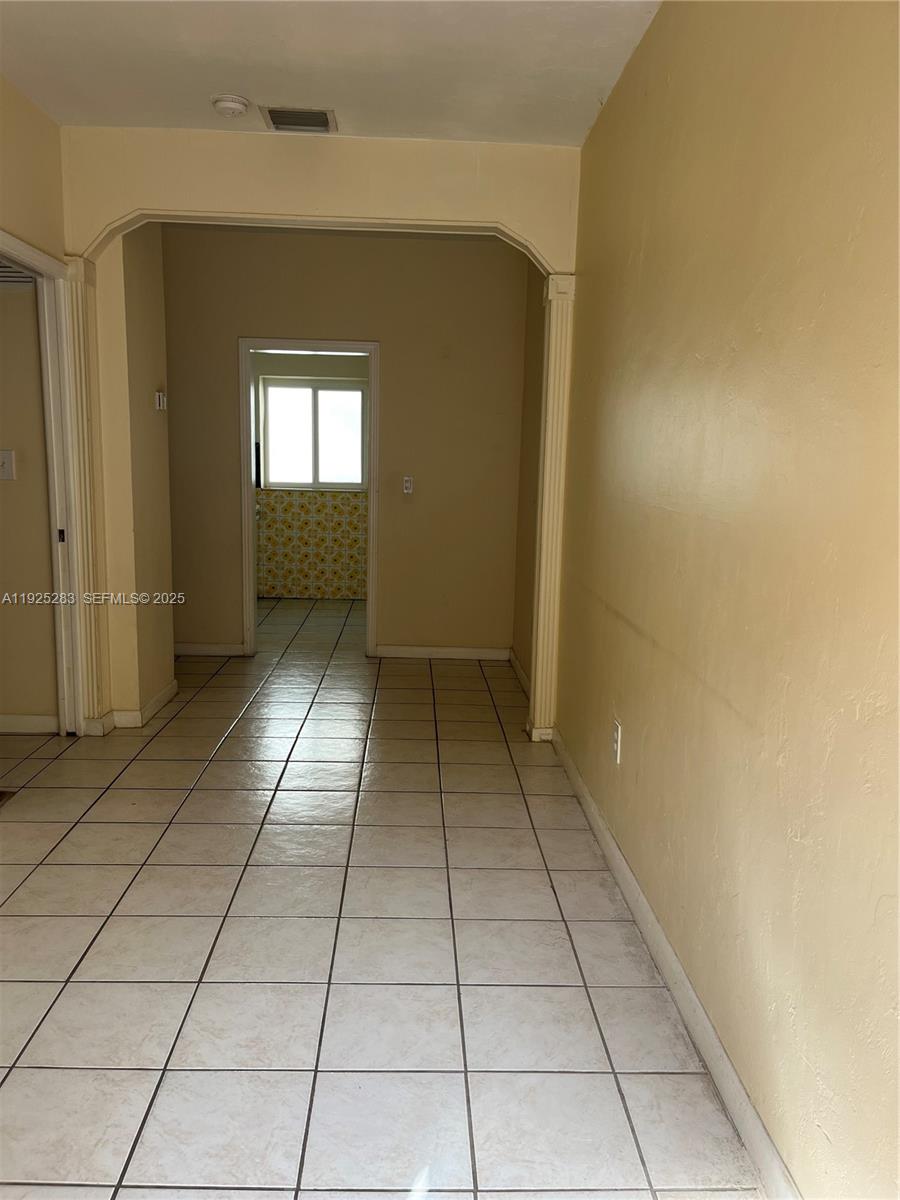 1035 Southwest 3rd Street, Unit 2 Miami, FL 33130 - Photo 5 of 13 a view of a hallway with a window
