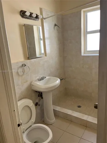 a kitchen with sink stove and cabinets