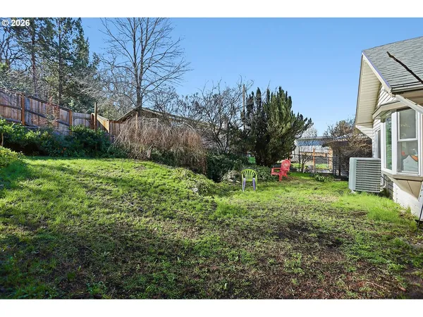a view of a backyard with a garden and plants