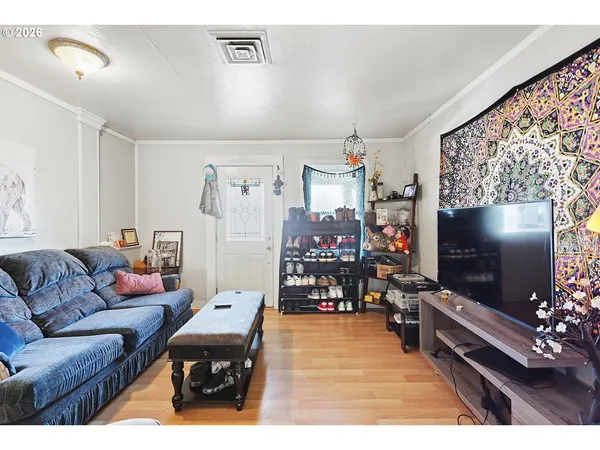 a living room with furniture and a flat screen tv