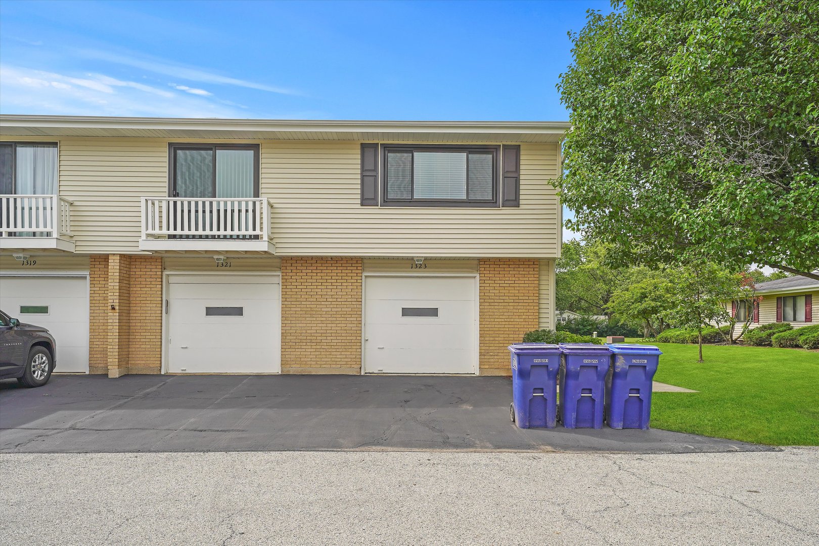 1323 Wakeby Lane, Unit 1323 Schaumburg, IL 60193 - Photo 2 of 14 a front view of a house with a yard
