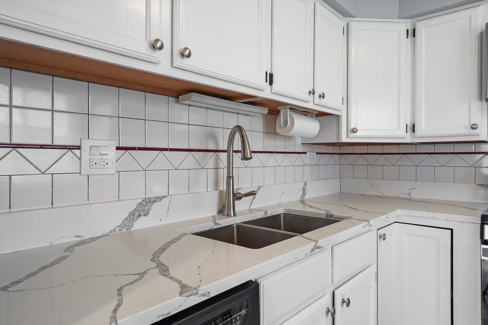 1323 Wakeby Lane, Unit 1323 Schaumburg, IL 60193 - Photo 7 of 14 a kitchen with a sink and cabinets