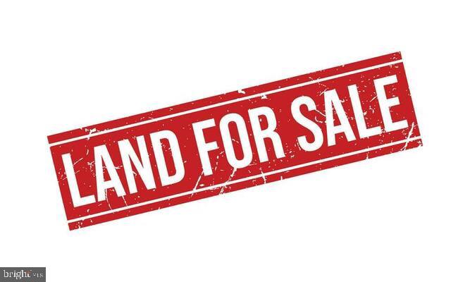 1410 North Main Road Vineland, NJ 08360 - Photo 4 of 4 a street sign sitting on top of a wall