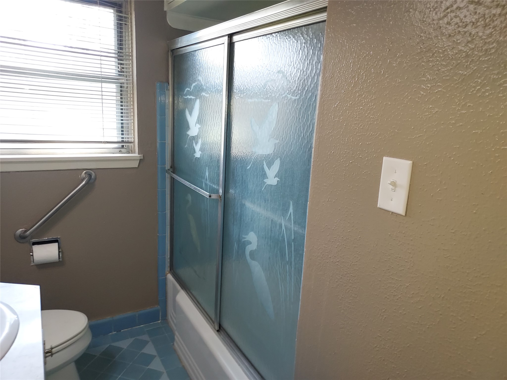1008 Meadowlane Street Angleton, TX 77515 - Photo 8 of 15 a bathroom with a granite countertop toilet a sink and a mirror