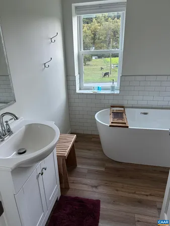 a view of a sink and a window in a room