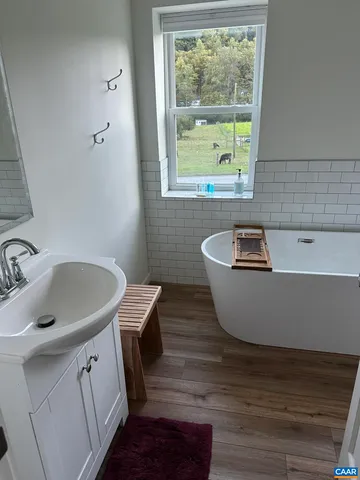 a view of a sink and a window in a room