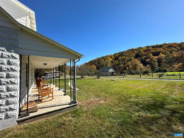 a view of a patio with a table and chairs
