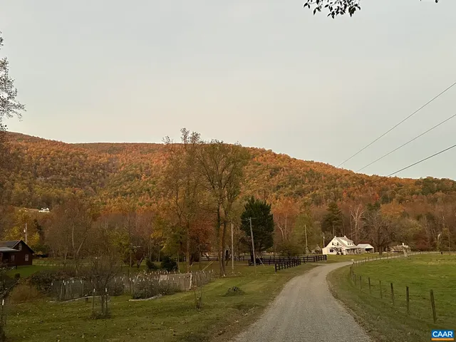 a view of a town with mountains in the background