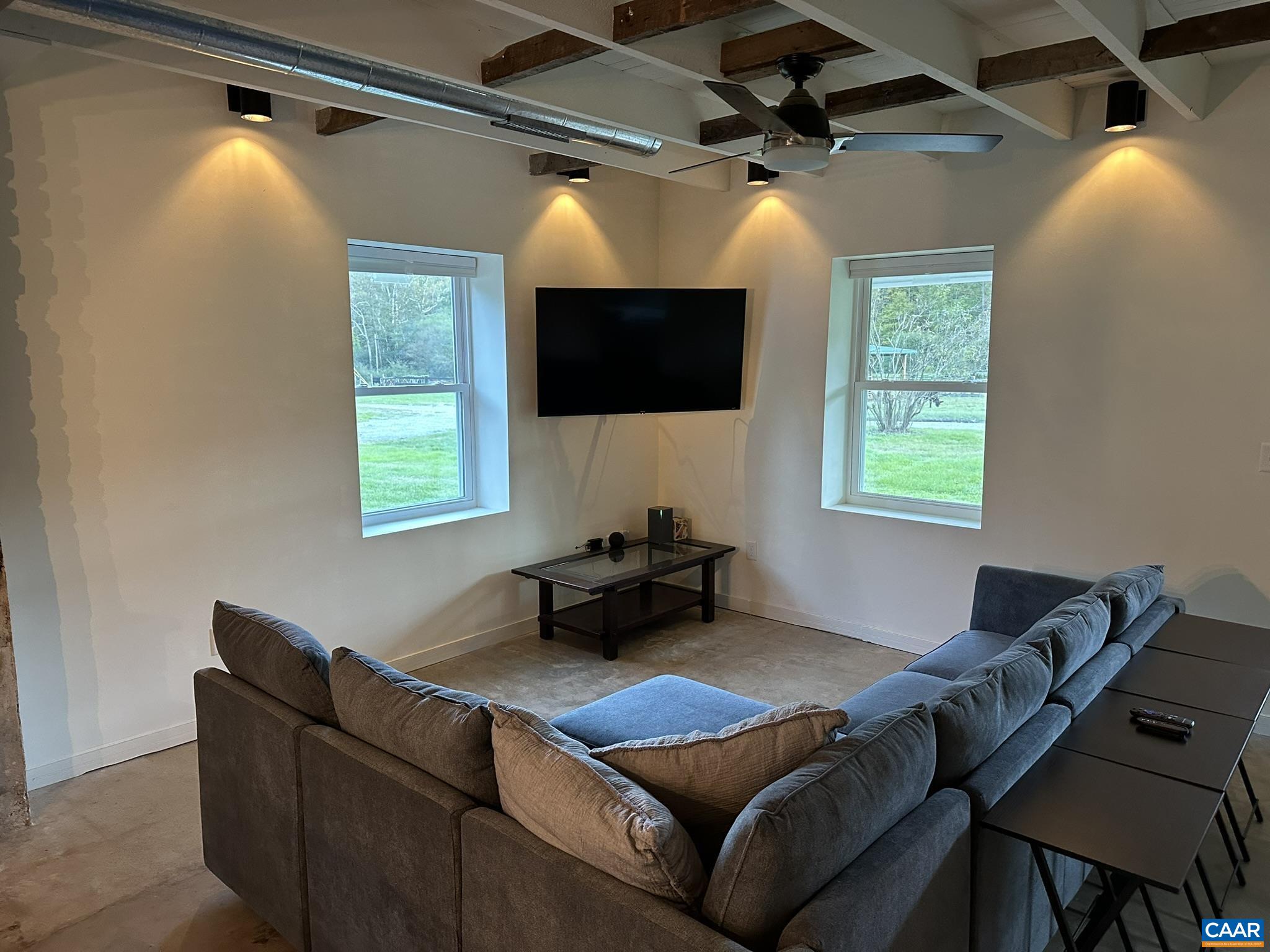 8817 Mission Home Road Free Union, VA 22940 - Photo 8 of 26 a living room with furniture and a flat screen tv