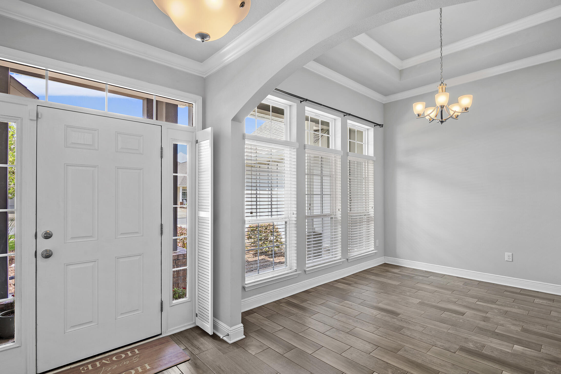 369 Lilly Bell Lane Freeport, FL 32439 - Photo 3 of 24 wooden floor in an empty room with a window