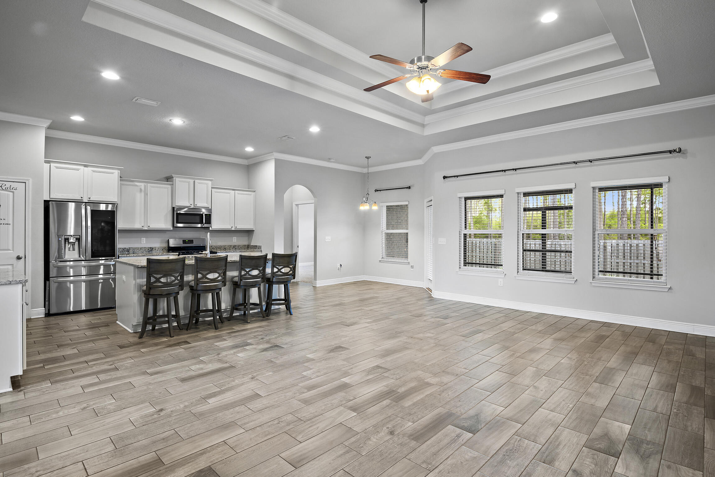 369 Lilly Bell Lane Freeport, FL 32439 - Photo 4 of 24 a view of dining room with furniture and kitchen view