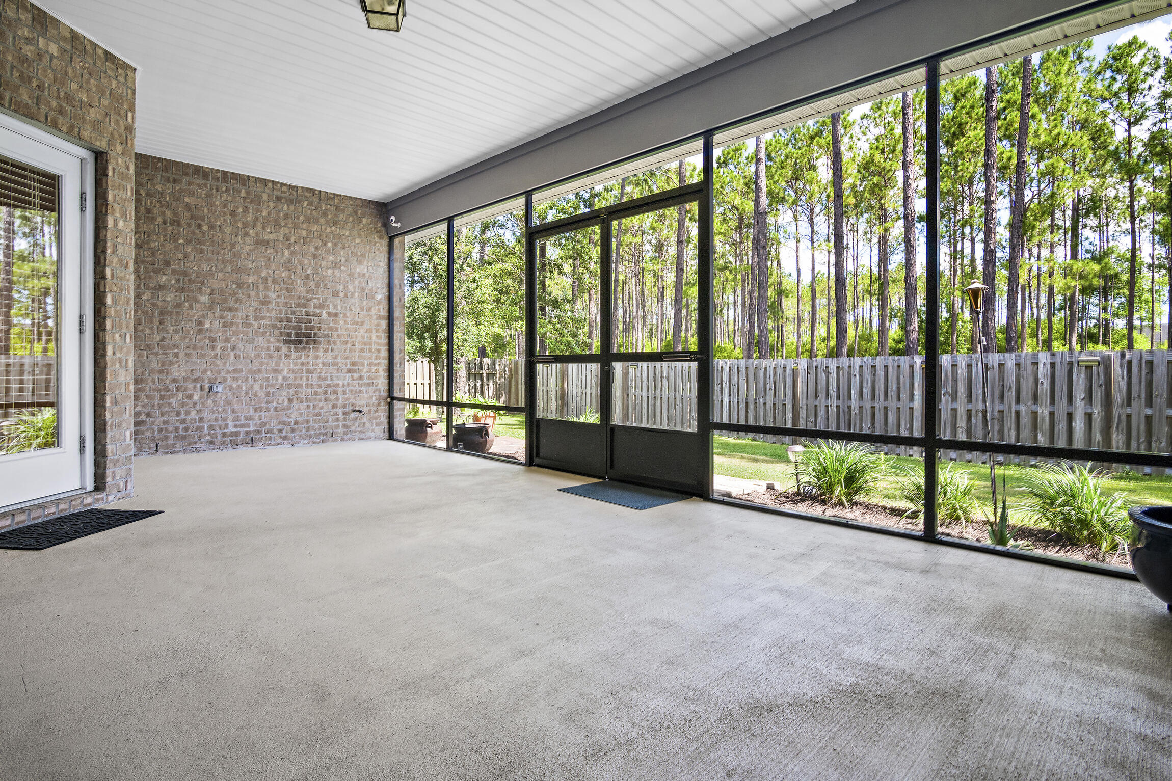 369 Lilly Bell Lane Freeport, FL 32439 - Photo 9 of 24 a view of empty room with floor to ceiling window