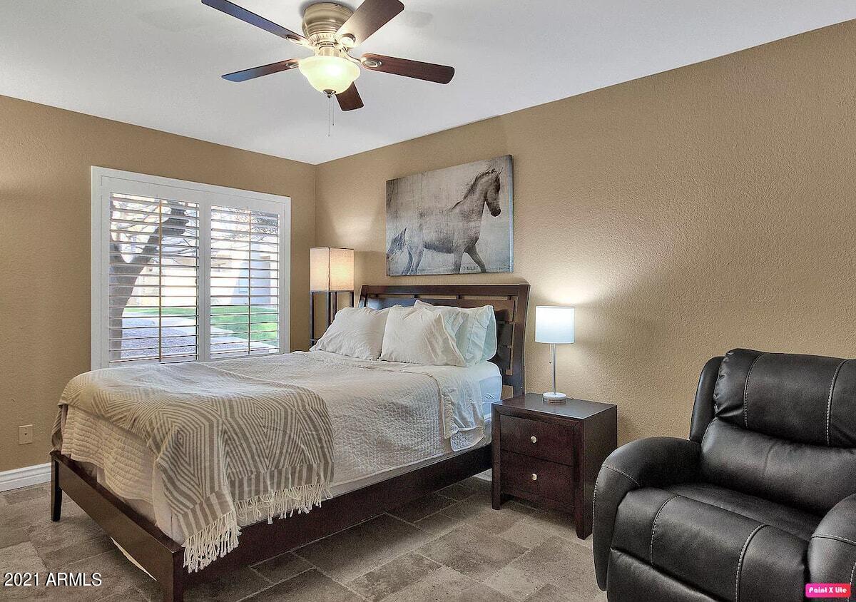 3500 North Hayden Road, Unit 1511 Scottsdale, AZ 85251 - Photo 11 of 26 a bedroom with a bed couch and window
