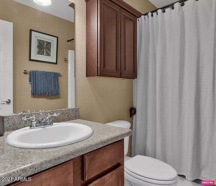 3500 North Hayden Road, Unit 1511 Scottsdale, AZ 85251 - Photo 15 of 26 a bathroom with a sink toilet and a mirror