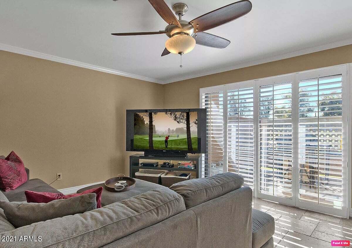 3500 North Hayden Road, Unit 1511 Scottsdale, AZ 85251 - Photo 2 of 26 a living room with furniture and a flat screen tv