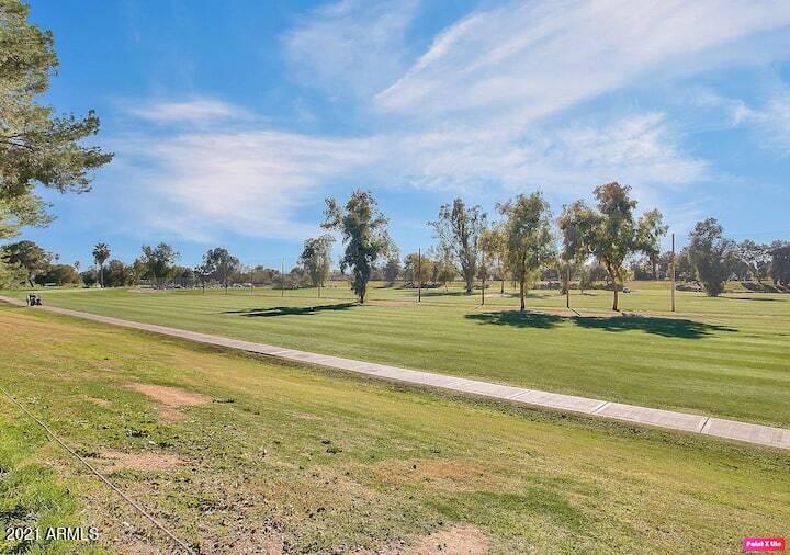 3500 North Hayden Road, Unit 1511 Scottsdale, AZ 85251 - Photo 21 of 26 a view of a golf course with a lake