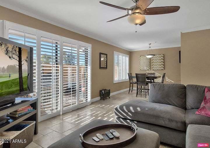 3500 North Hayden Road, Unit 1511 Scottsdale, AZ 85251 - Photo 3 of 26 a living room with furniture and a flat screen tv