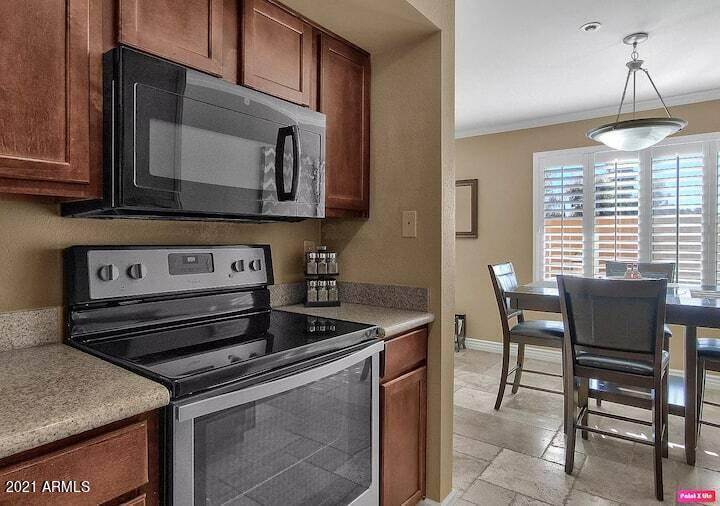 3500 North Hayden Road, Unit 1511 Scottsdale, AZ 85251 - Photo 7 of 26 a kitchen with a stove and a microwave