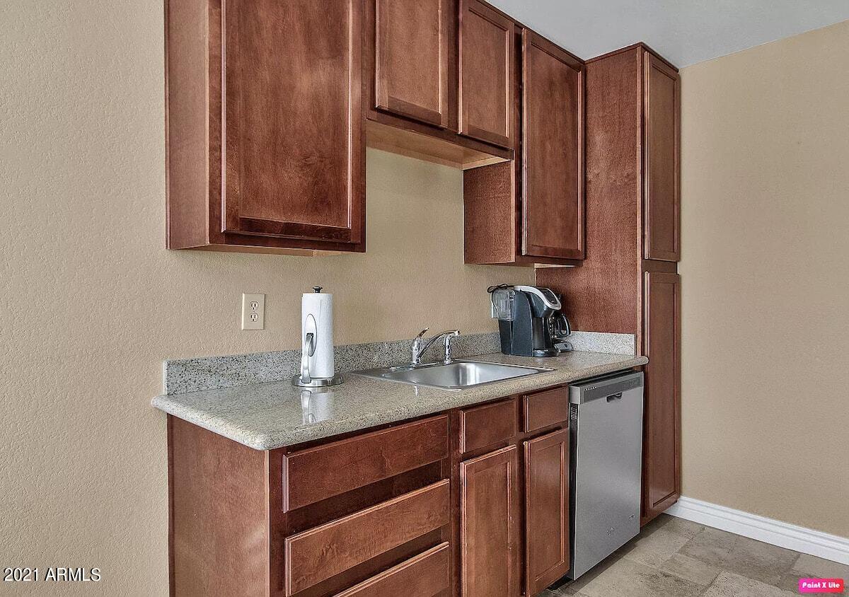 3500 North Hayden Road, Unit 1511 Scottsdale, AZ 85251 - Photo 8 of 26 a kitchen with stainless steel appliances granite countertop a sink stove and cabinets