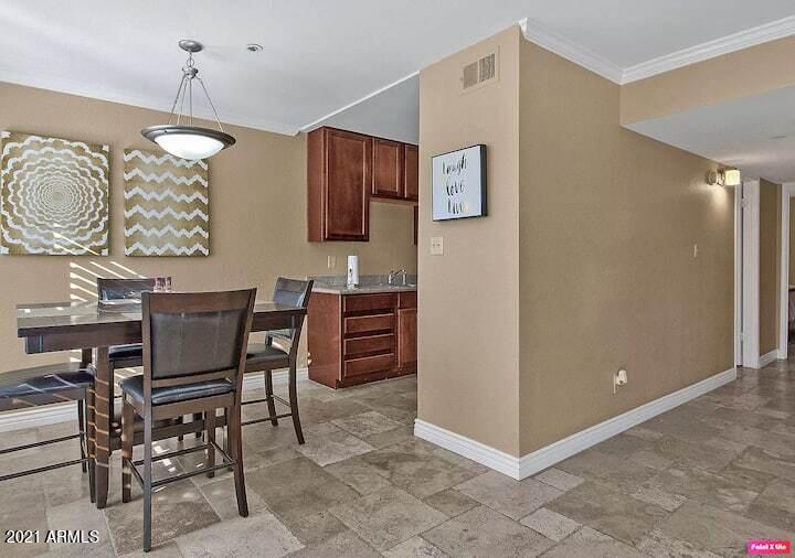3500 North Hayden Road, Unit 1511 Scottsdale, AZ 85251 - Photo 9 of 26 a view of a dining room with furniture