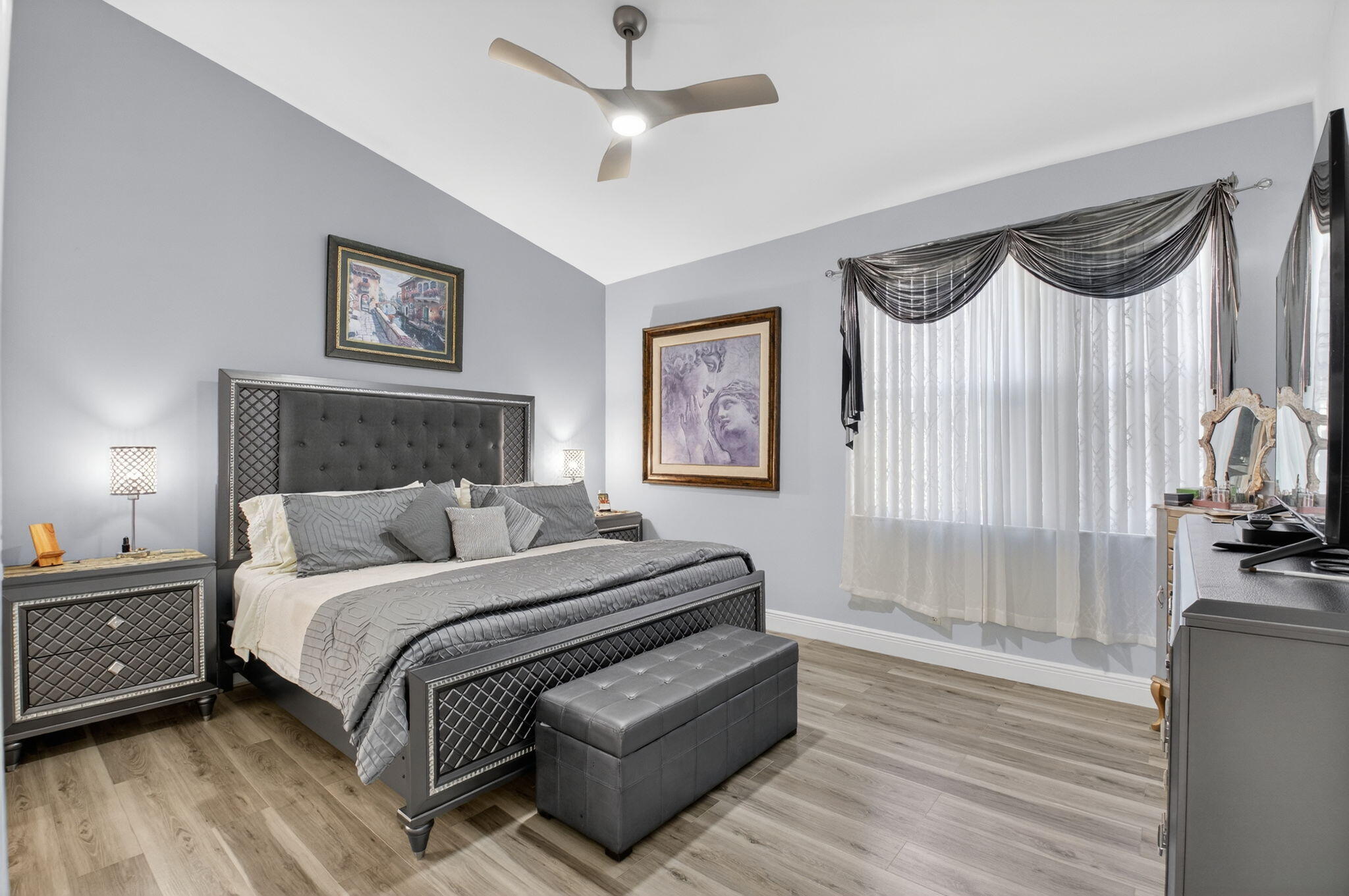 6247 Heliconia Road Delray Beach, FL 33484 - Photo 11 of 25 a bedroom with a bed a dresser and a window