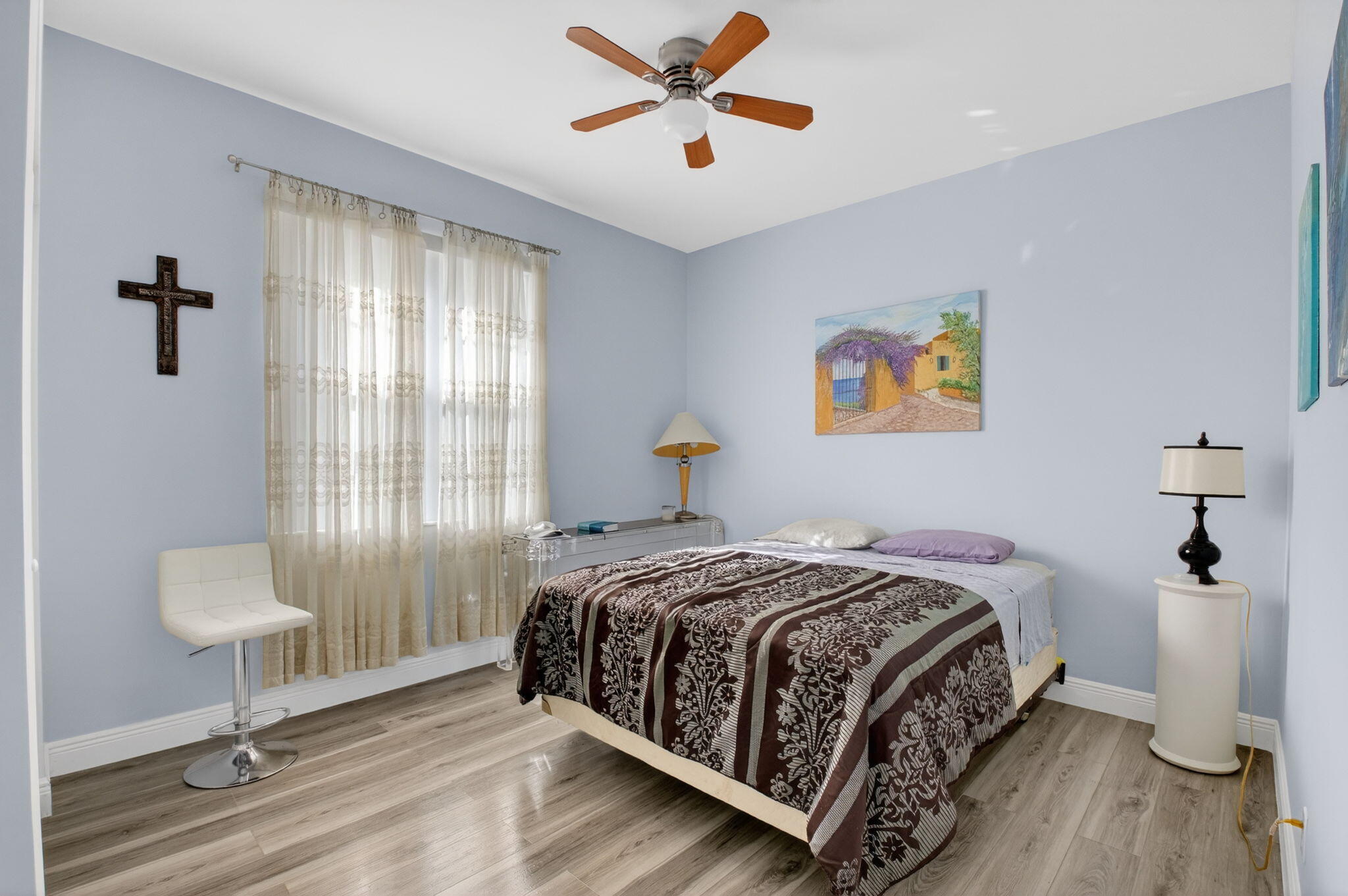 6247 Heliconia Road Delray Beach, FL 33484 - Photo 17 of 25 a bedroom with a bed and a chandelier