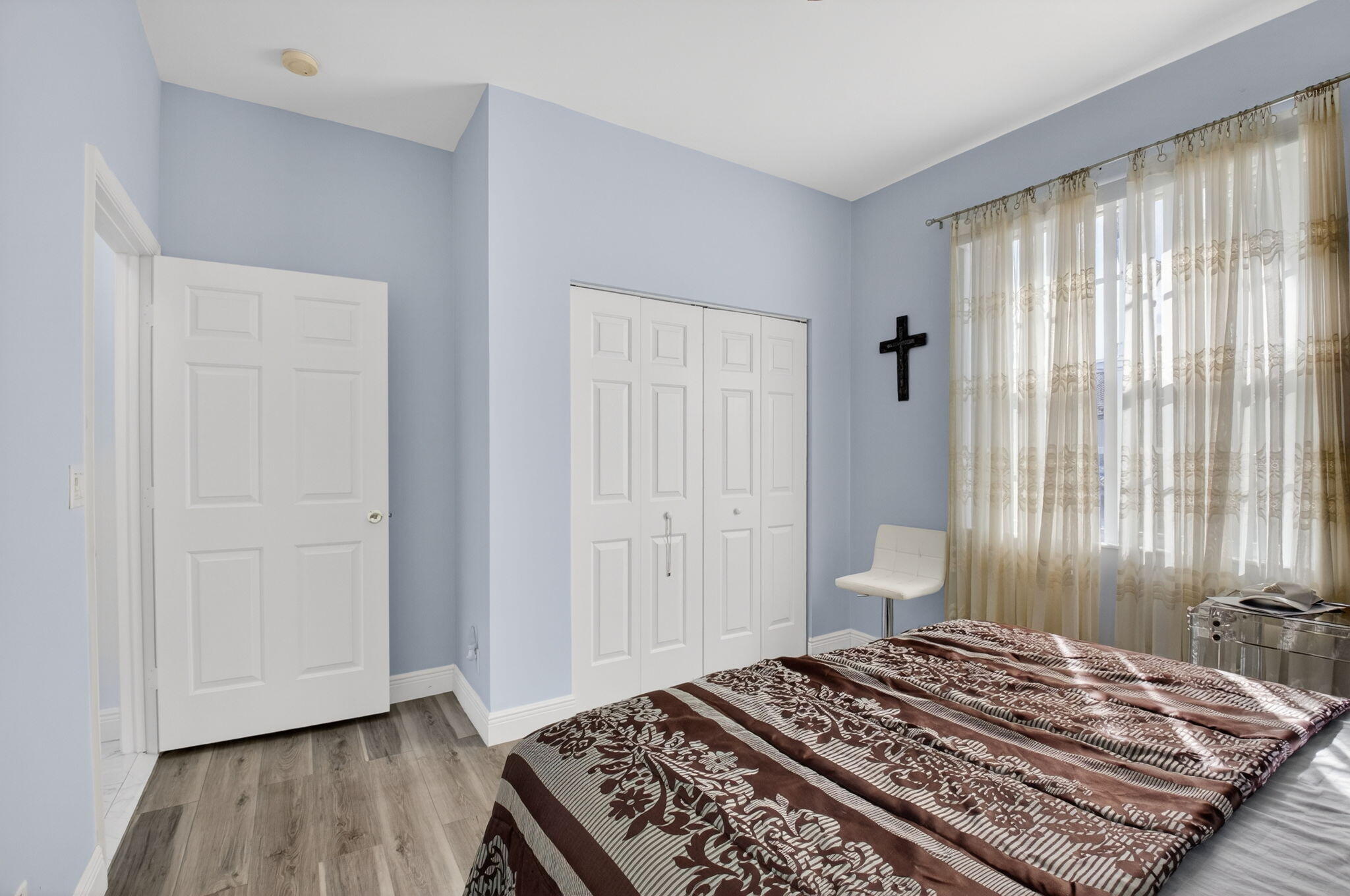 6247 Heliconia Road Delray Beach, FL 33484 - Photo 18 of 25 a bedroom with a bed and a window