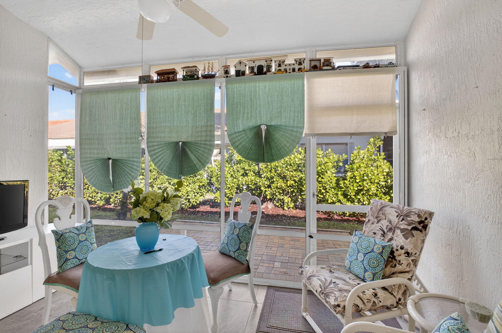 6247 Heliconia Road Delray Beach, FL 33484 - Photo 21 of 25 a dining room with furniture and a potted plant