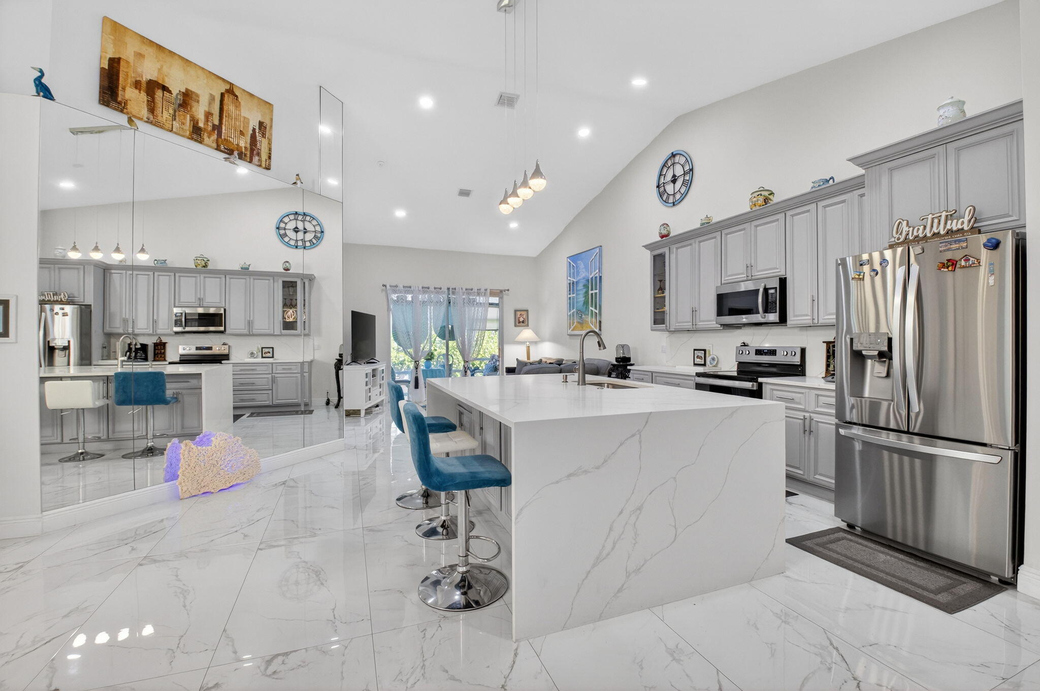 6247 Heliconia Road Delray Beach, FL 33484 - Photo 6 of 25 a kitchen with cabinets and chairs