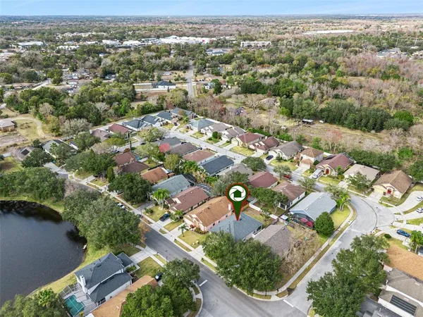 an aerial view of residential houses with outdoor space